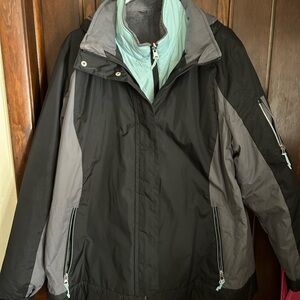 Free Country Women's Black and Gray Ski Jacket with Mint under jacket.